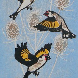 Goldfinches in flight, Striped Pebble